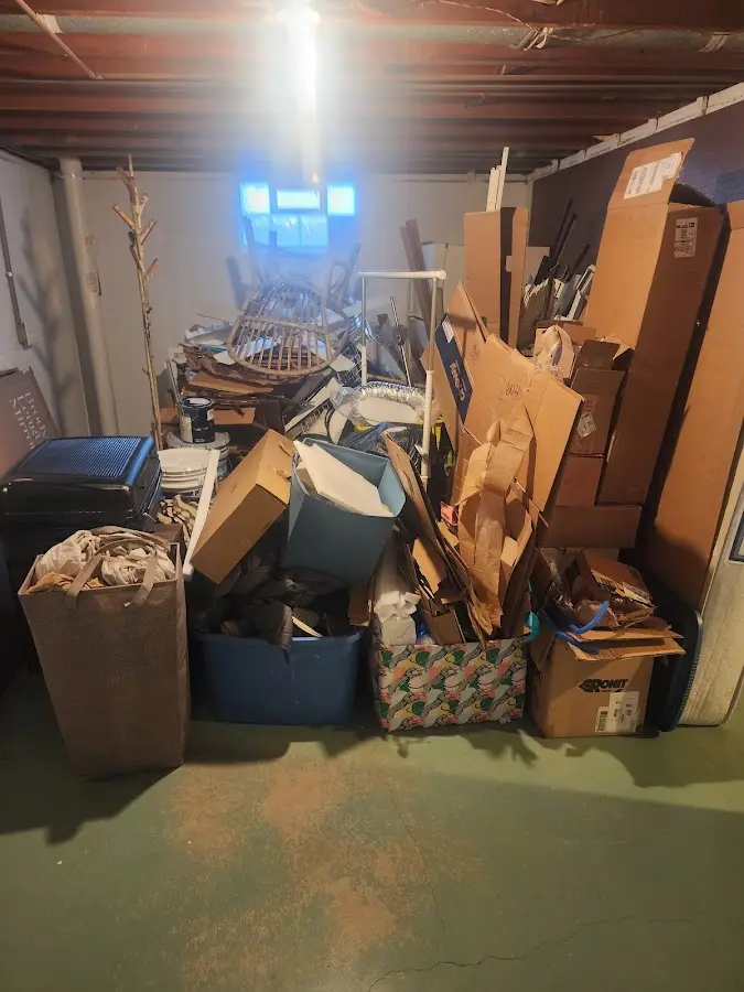 Roll-off dumpster container at job site for 4 Yard Dumpster Rental in St. James